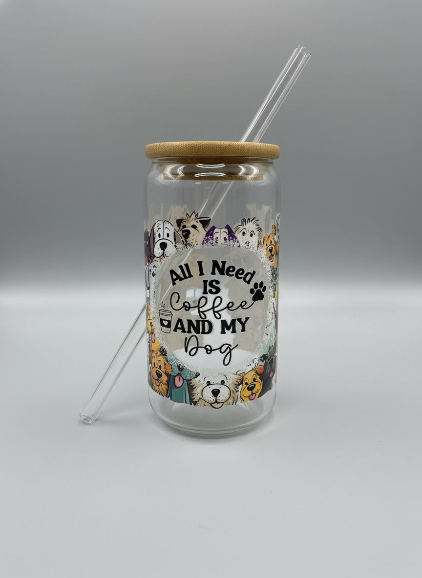 Clear glass tumbler with dog illustrations and text on a black surface