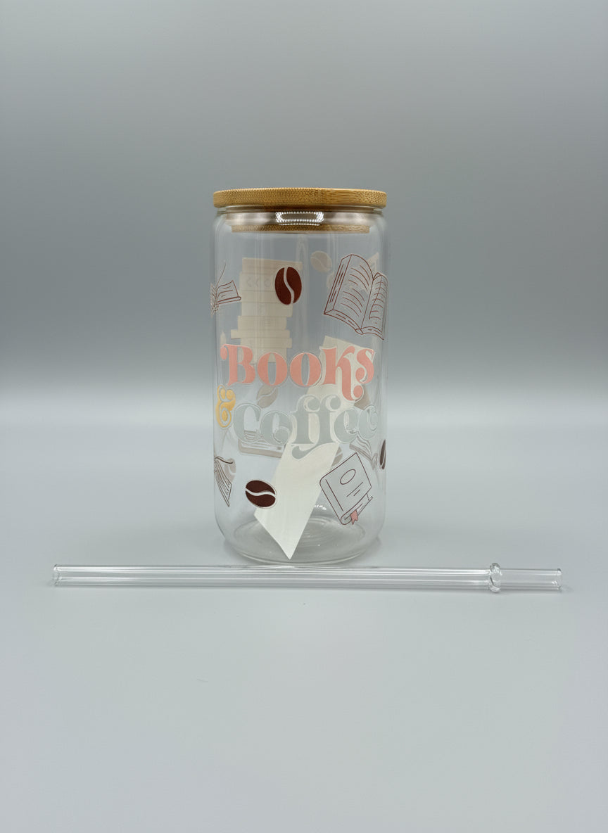 Clear tumbler with 'Books and Coffee' design on a black surface with a glittery background