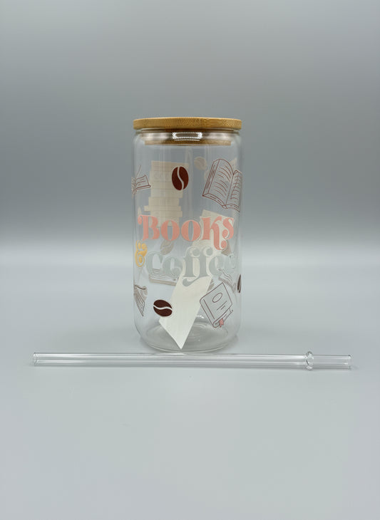 Clear tumbler with 'Books and Coffee' design on a black surface with a glittery background