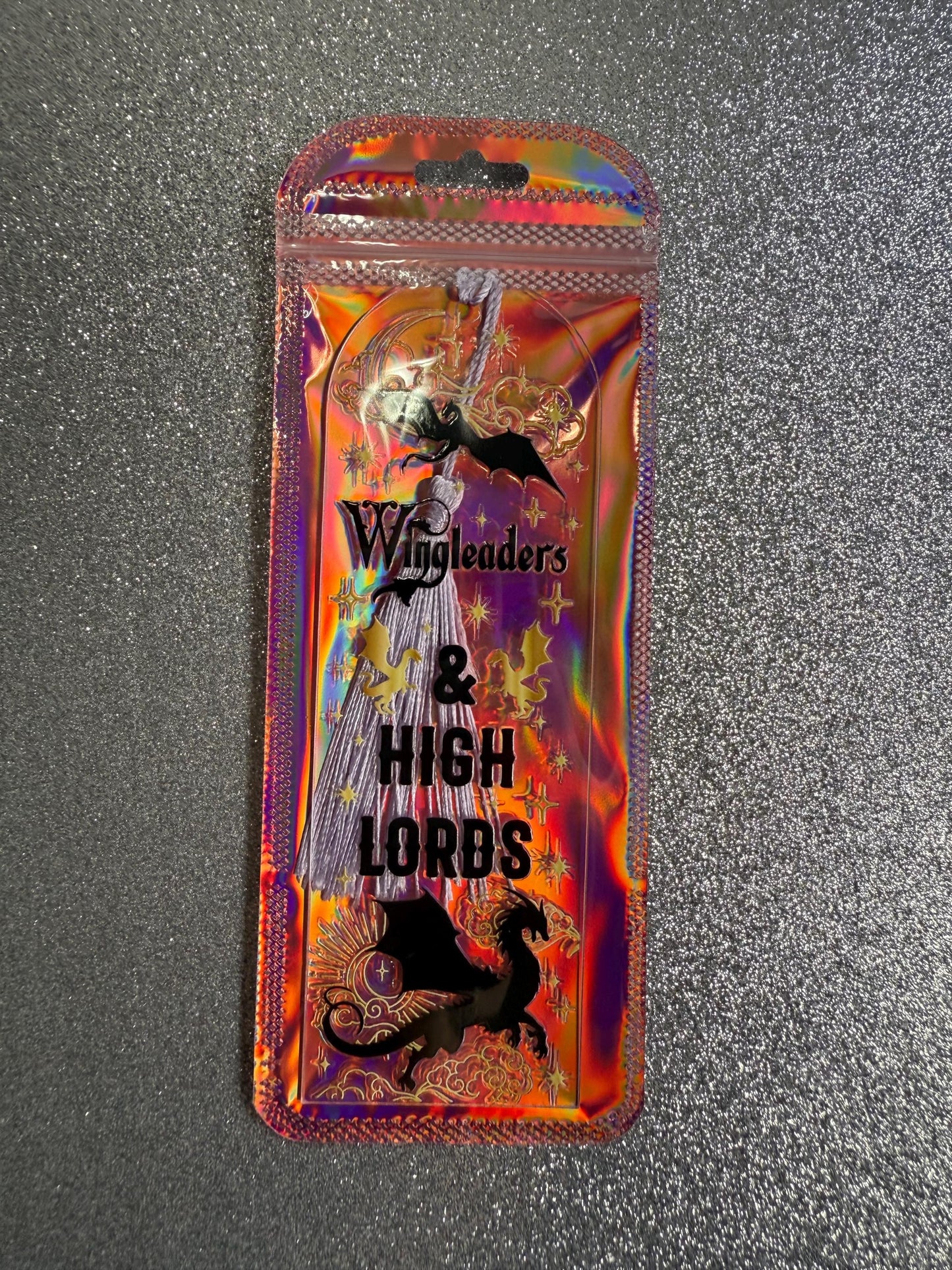 Packaged product with 'Wingaders & High Lords' branding on a textured gray background