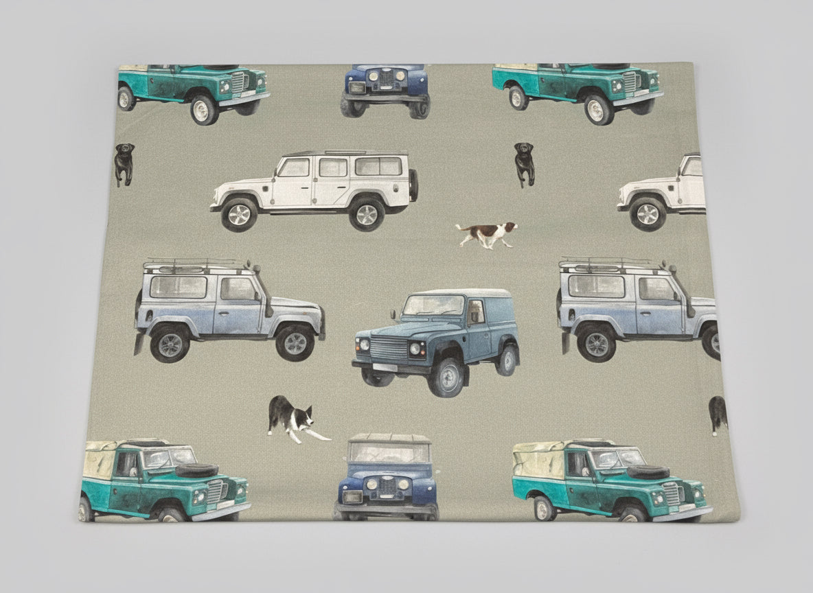 Fabric with pattern of vintage cars and dogs on a gray background