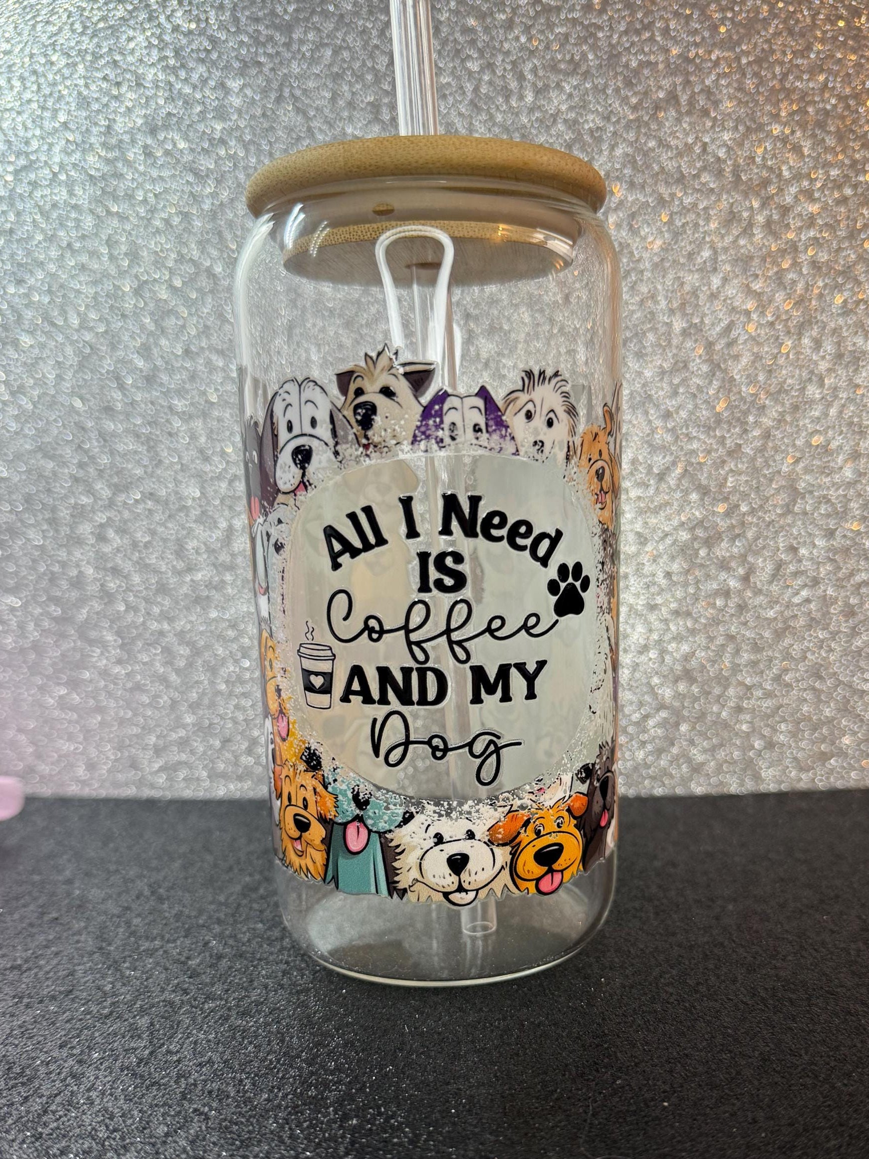 Tumbler with dog-themed design and text 'All I Need is Coffee and My Dog' on a glittery background.