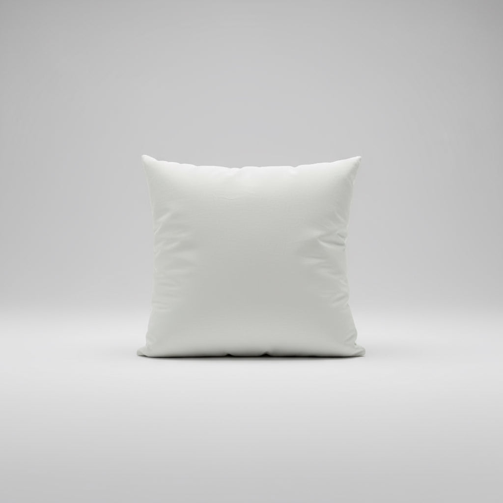 White pillow on a bed with a blurred background