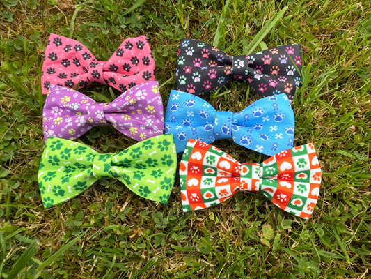 Set of colorful bow ties on a grassy background