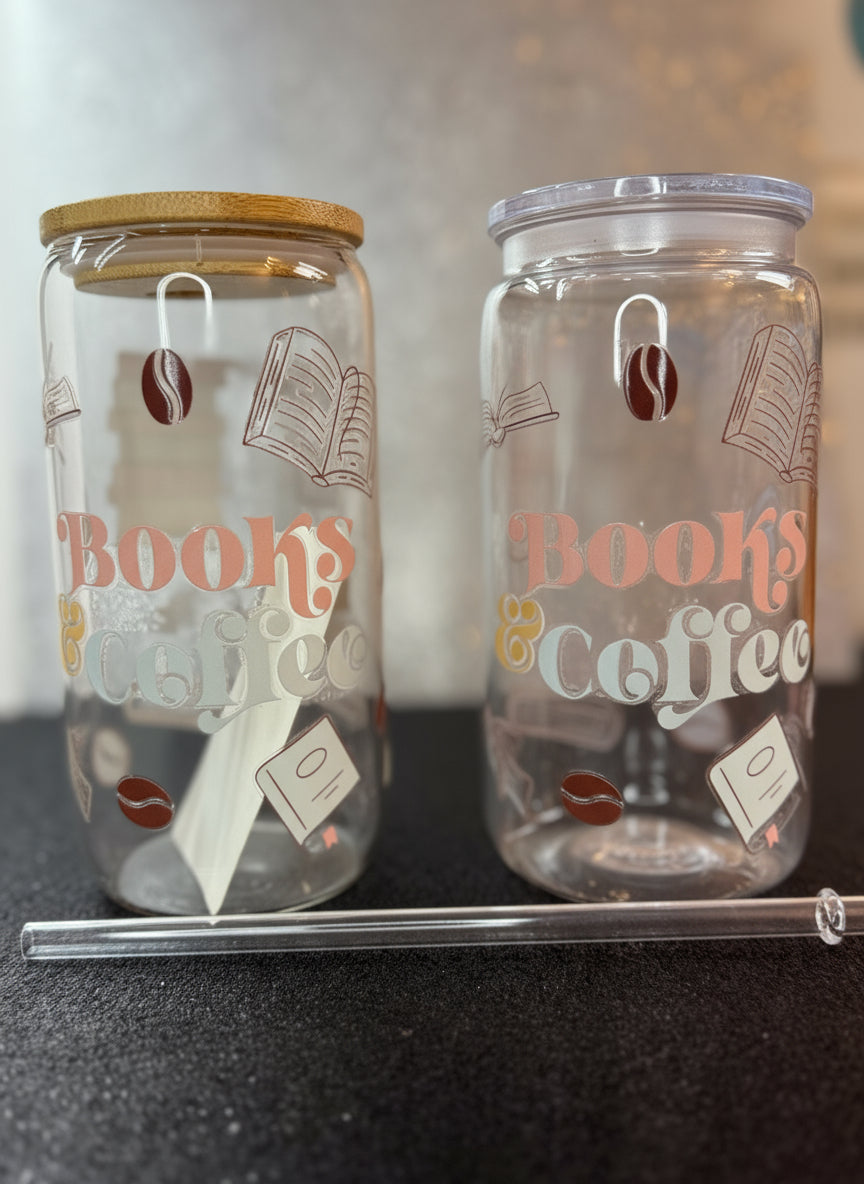 Two glass tumbler  with 'Books & Coffee' text and decorative elements on a dark surface.