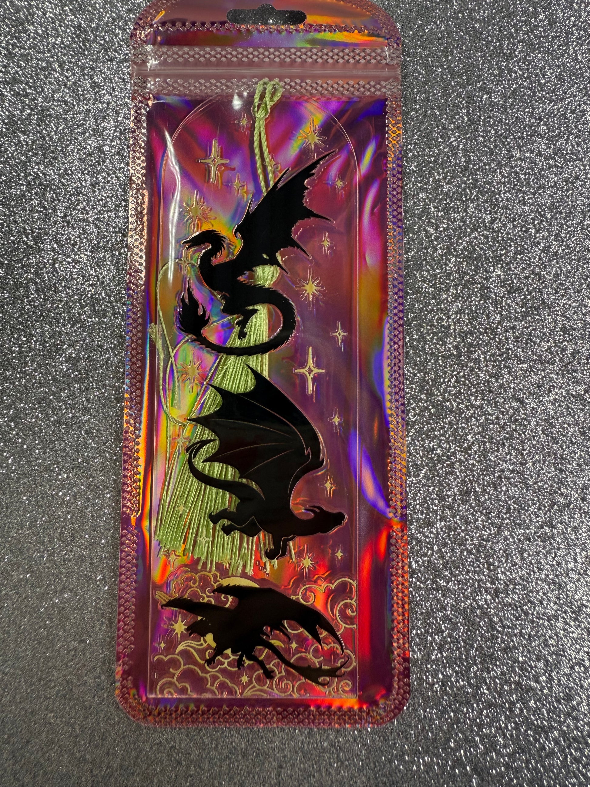 Holographic wallet with dragon design on a reflective surface