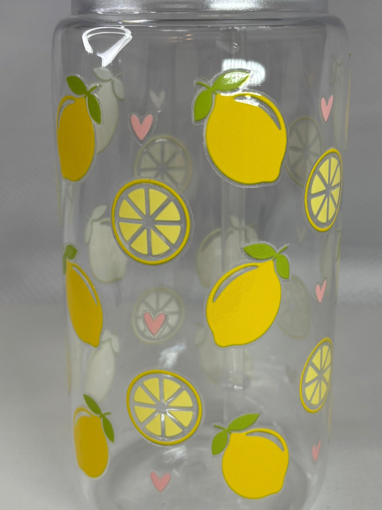 Clear tumbler with lemon pattern on a white background