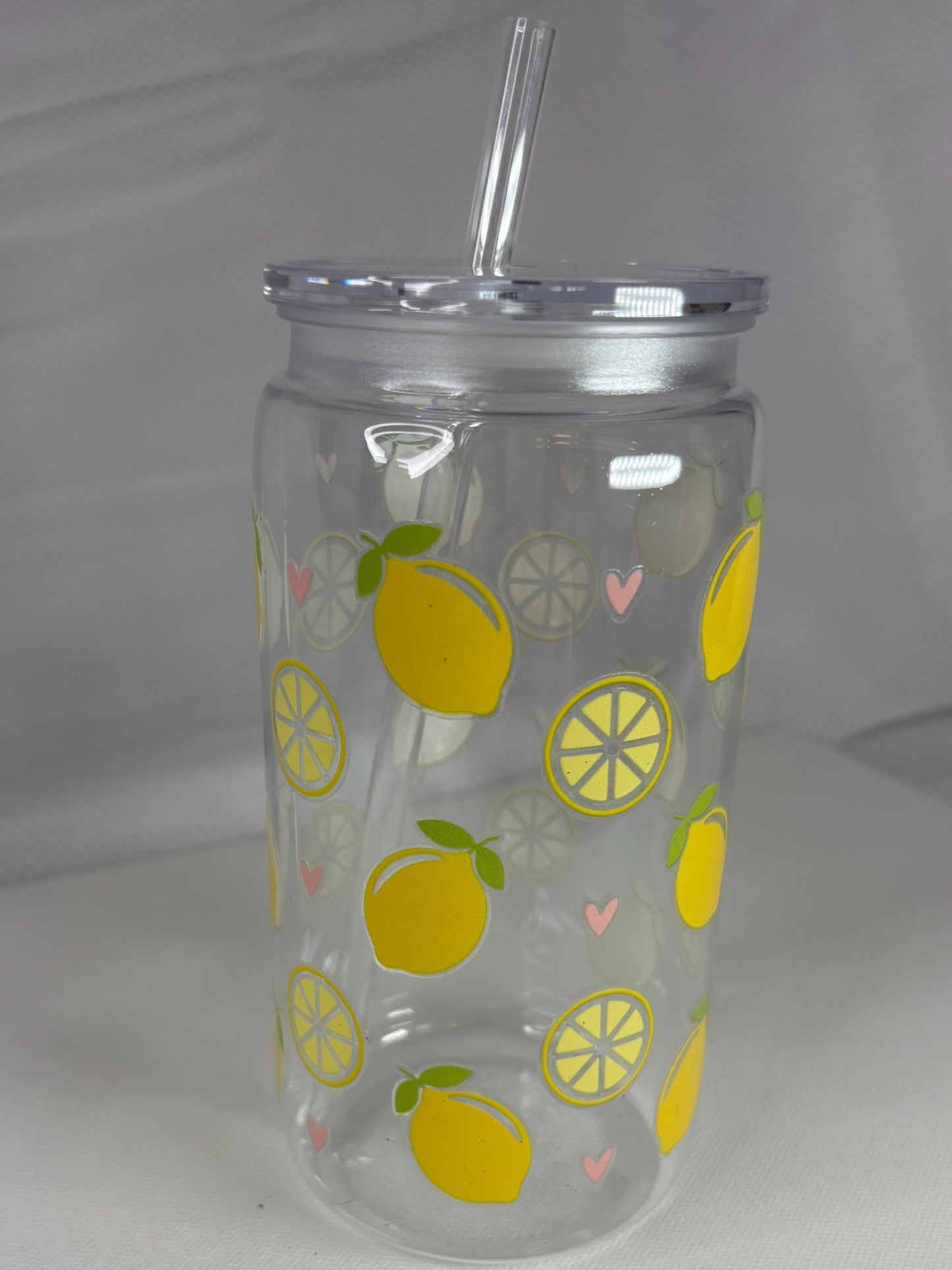 Clear tumbler with lemon pattern on a white background