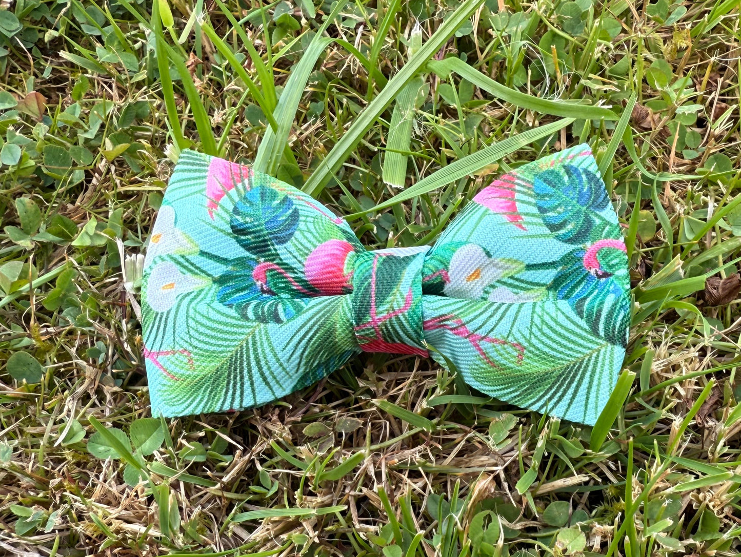 Floral-patterned bow tie on grass