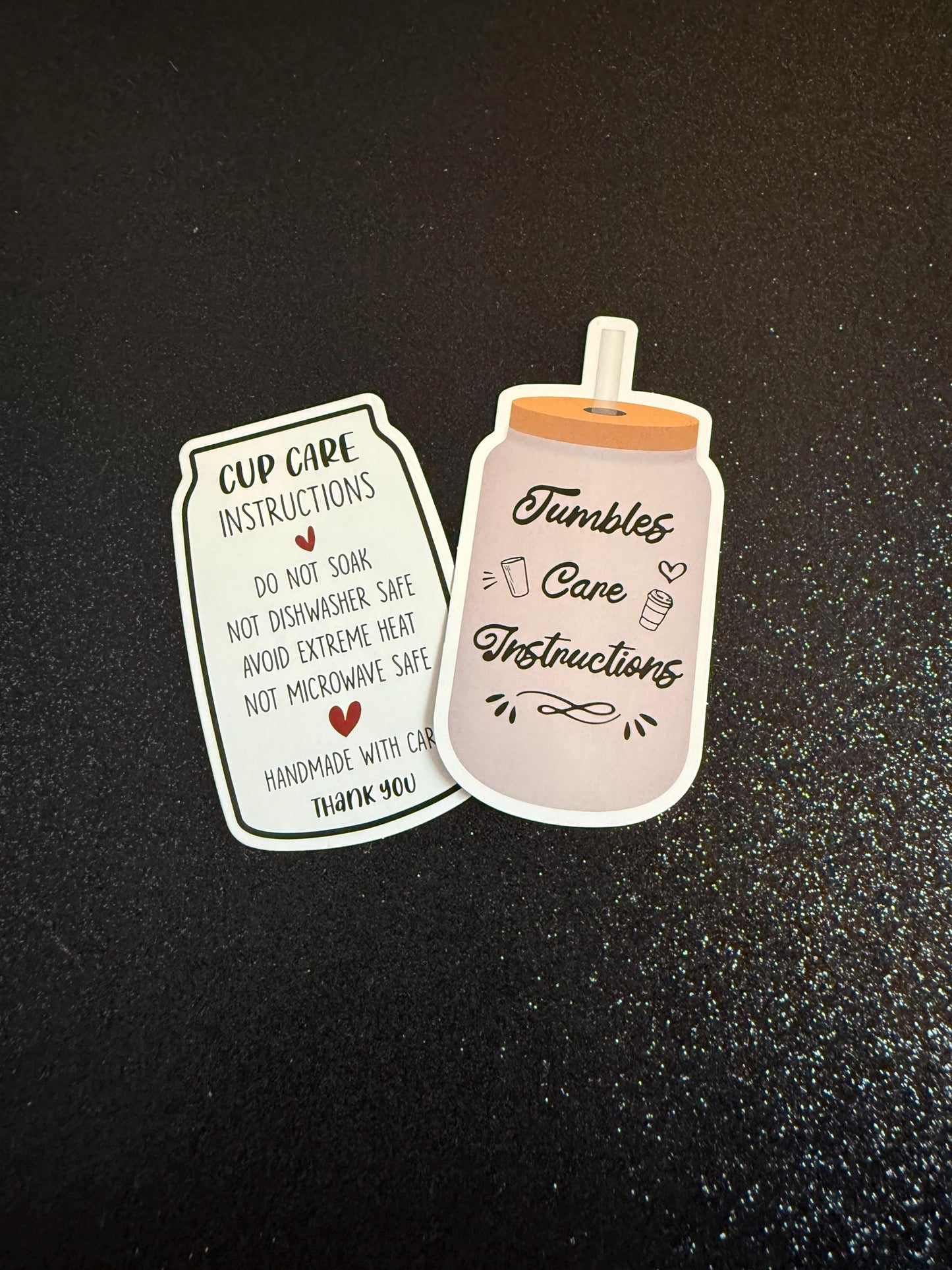 Two decorative stickers resembling a jar and a bottle on a black background