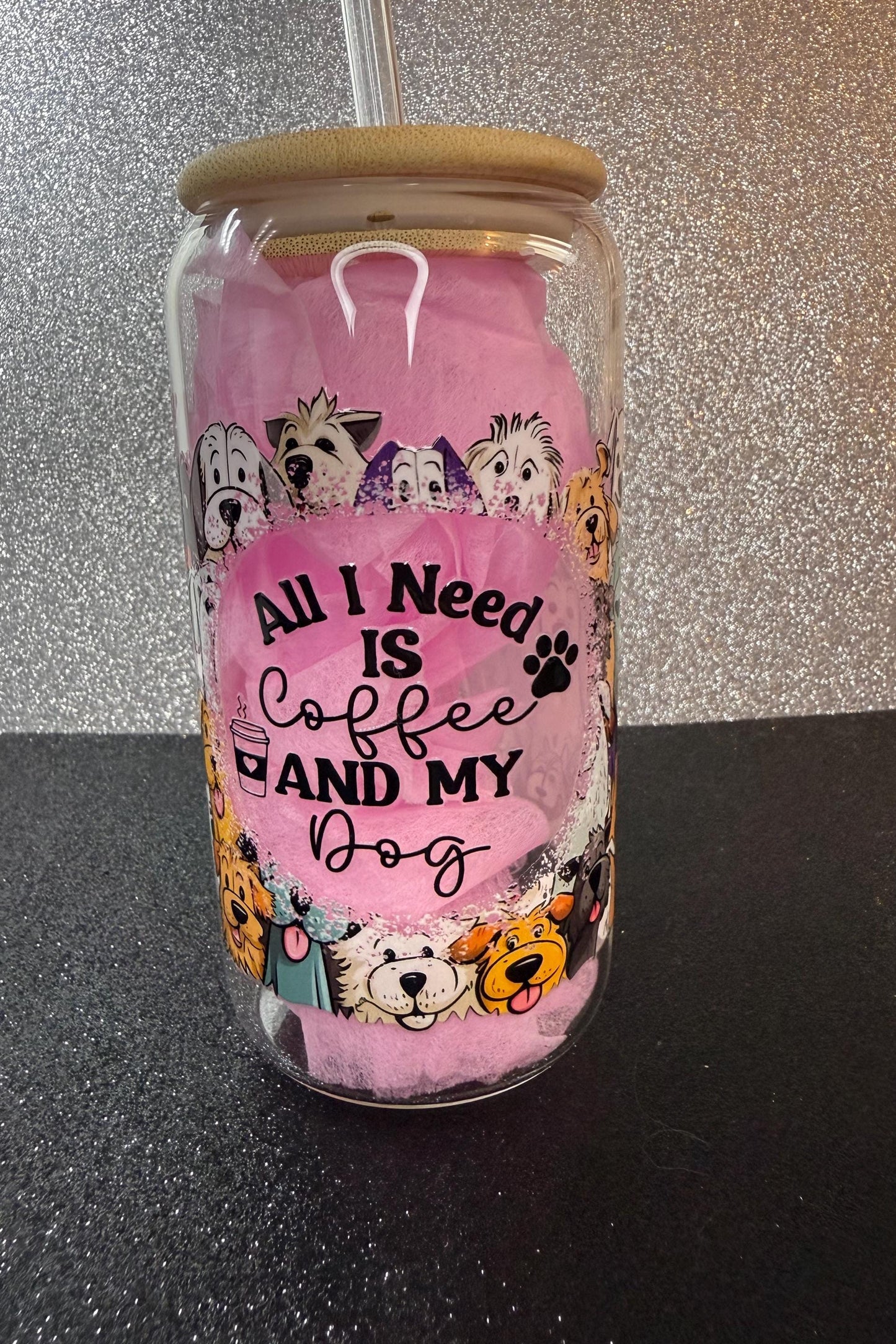 Tumbler with dog-themed design and text 'All I Need is Coffee and My Dog' on a glittery background.