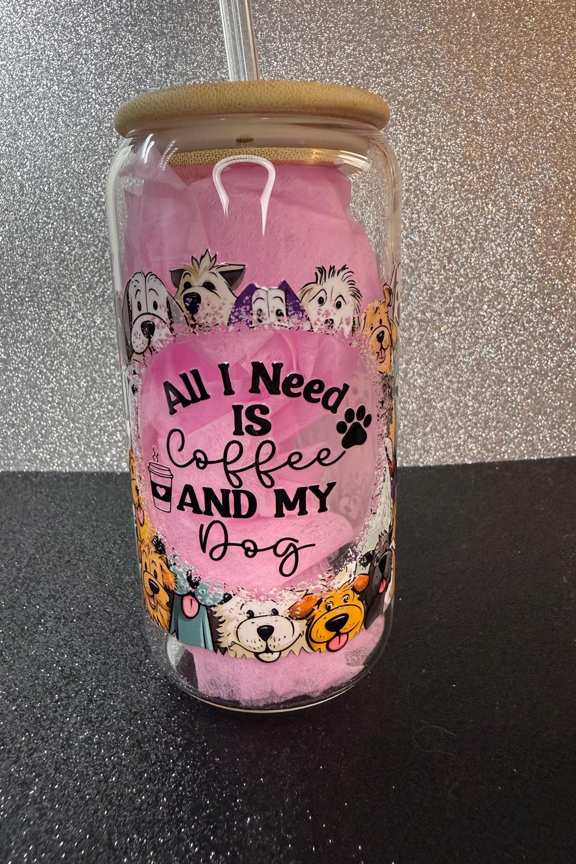 Tumbler with dog-themed design and text 'All I Need is Coffee and My Dog' on a glittery background.