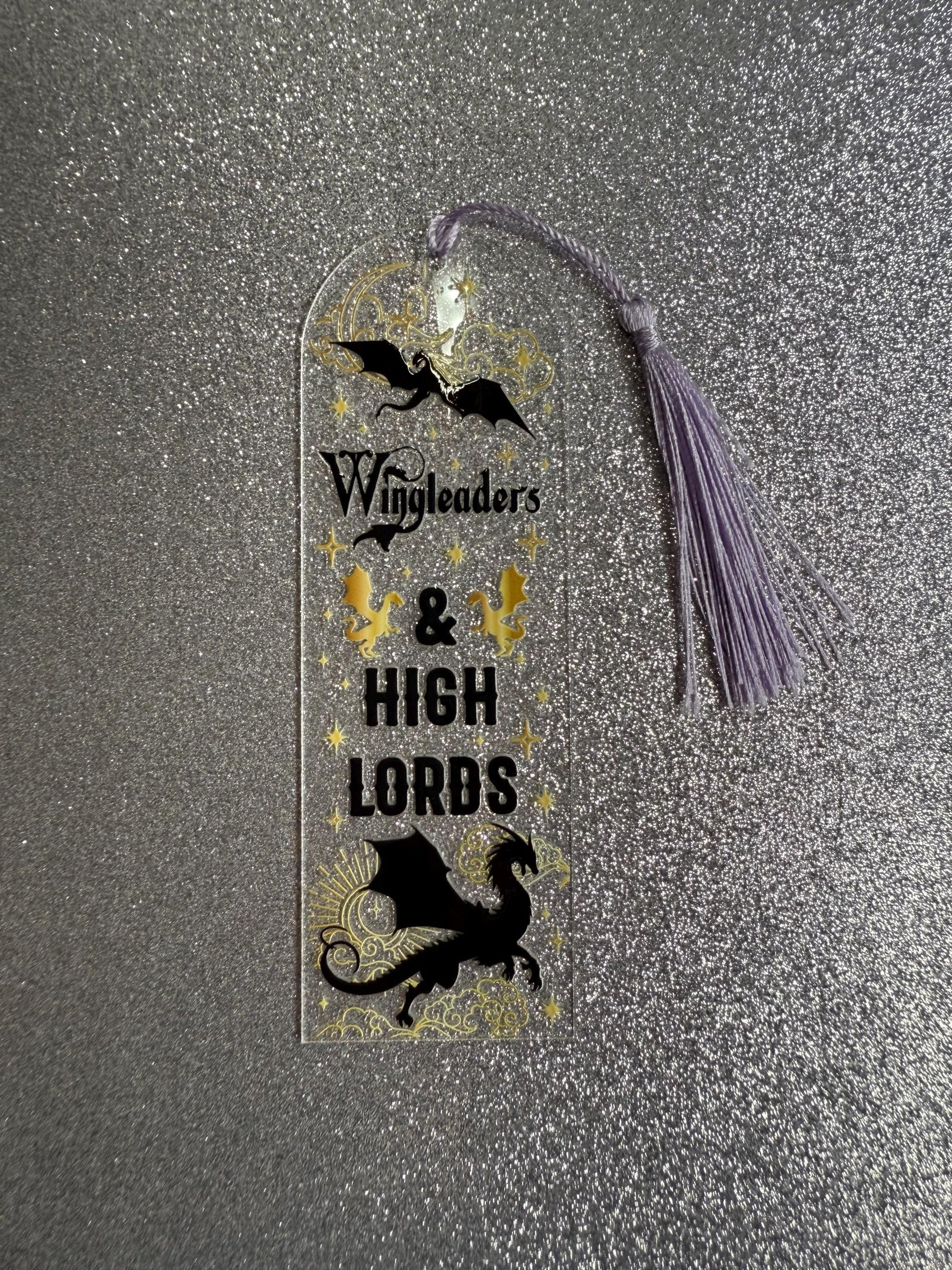 Bookmark with dragons and text on a metallic surface
